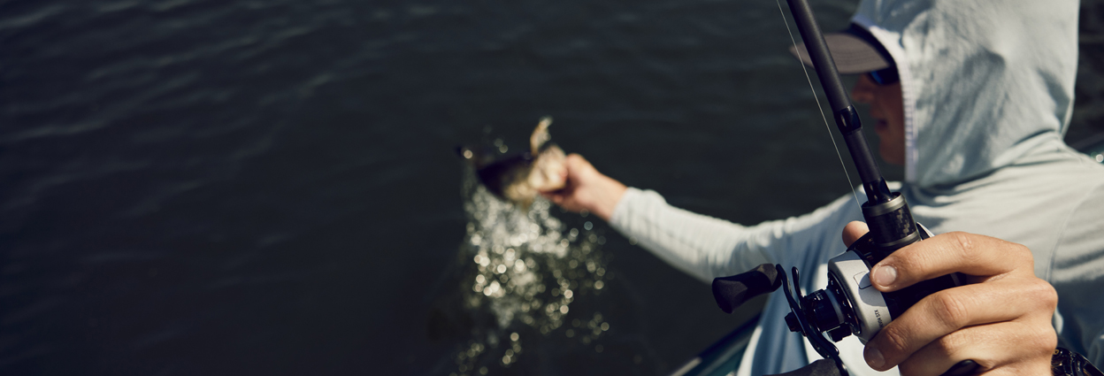 Angler pulling bass out of the water 